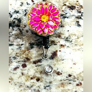 Flower badge reel. Badge pull.